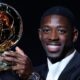 Paris Saint-Germain's French forward Ousmane Dembele reacts receiving the Ballon d'Or award during the 2025 Ballon d'Or France Football award ceremony at the Theatre du Chatelet in Paris on September 22, 2025. (Photo by Franck FIFE / AFP)