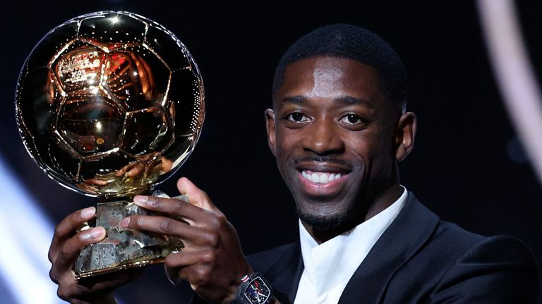 Paris Saint-Germain's French forward Ousmane Dembele reacts receiving the Ballon d'Or award during the 2025 Ballon d'Or France Football award ceremony at the Theatre du Chatelet in Paris on September 22, 2025. (Photo by Franck FIFE / AFP)