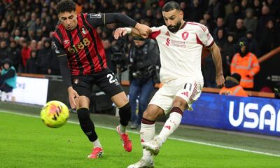 Mohamed Salah gets a cross into the Bournemouth box under pressure from James Hill