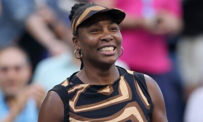 Venus Williams of the United States celebrates with partner Leylah Fernandez of Canada (not pictured) after defeating Shuai Zhang of China a