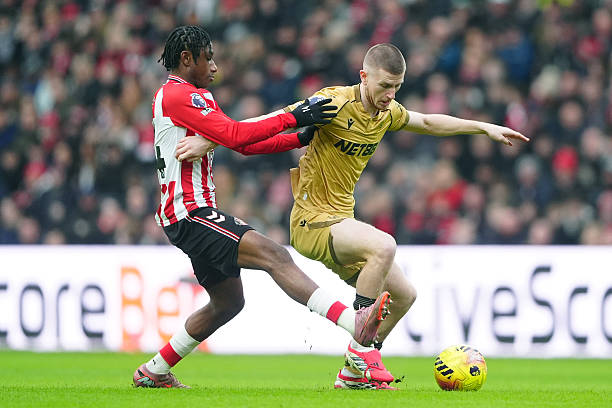 Sunderland's Romaine Mundle and Crystal Palace's Adam Wharton battle for the ball during the Premier League match at the Stadium of Light,...