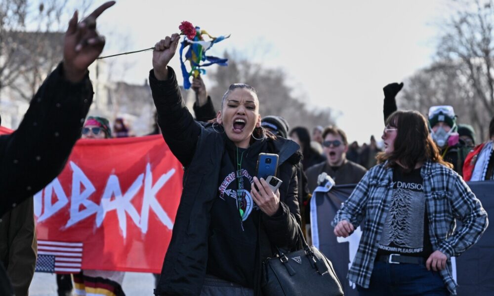 Minneapolis officials urge calm after fatal shooting of a woman by an ICE officer