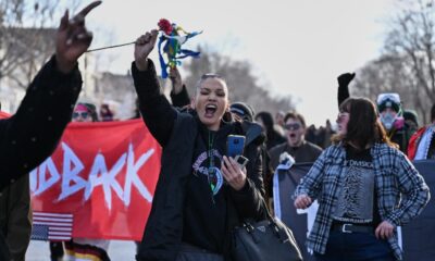 Minneapolis officials urge calm after fatal shooting of a woman by an ICE officer