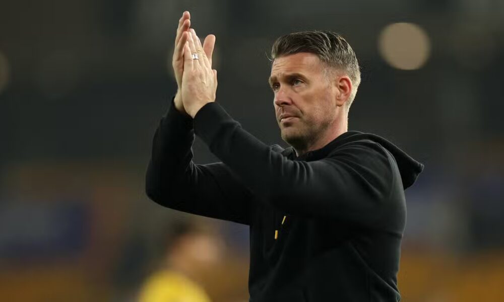Wolverhampton Wanderers manager Rob Edwards applauds fans after the match