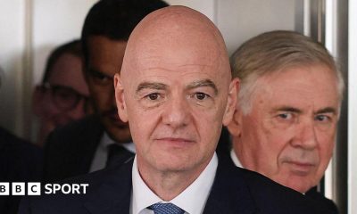 Gianni Infantino on duty for Fifa, with Brazil coach Carlo Ancelotti in the background