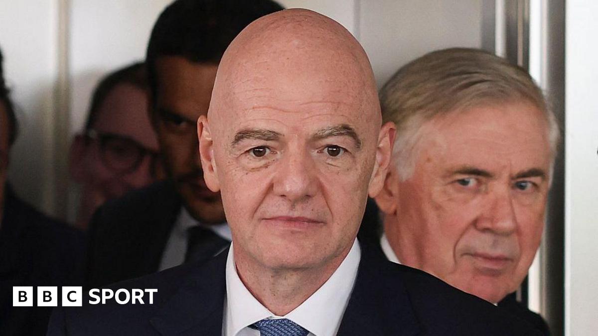 Gianni Infantino on duty for Fifa, with Brazil coach Carlo Ancelotti in the background