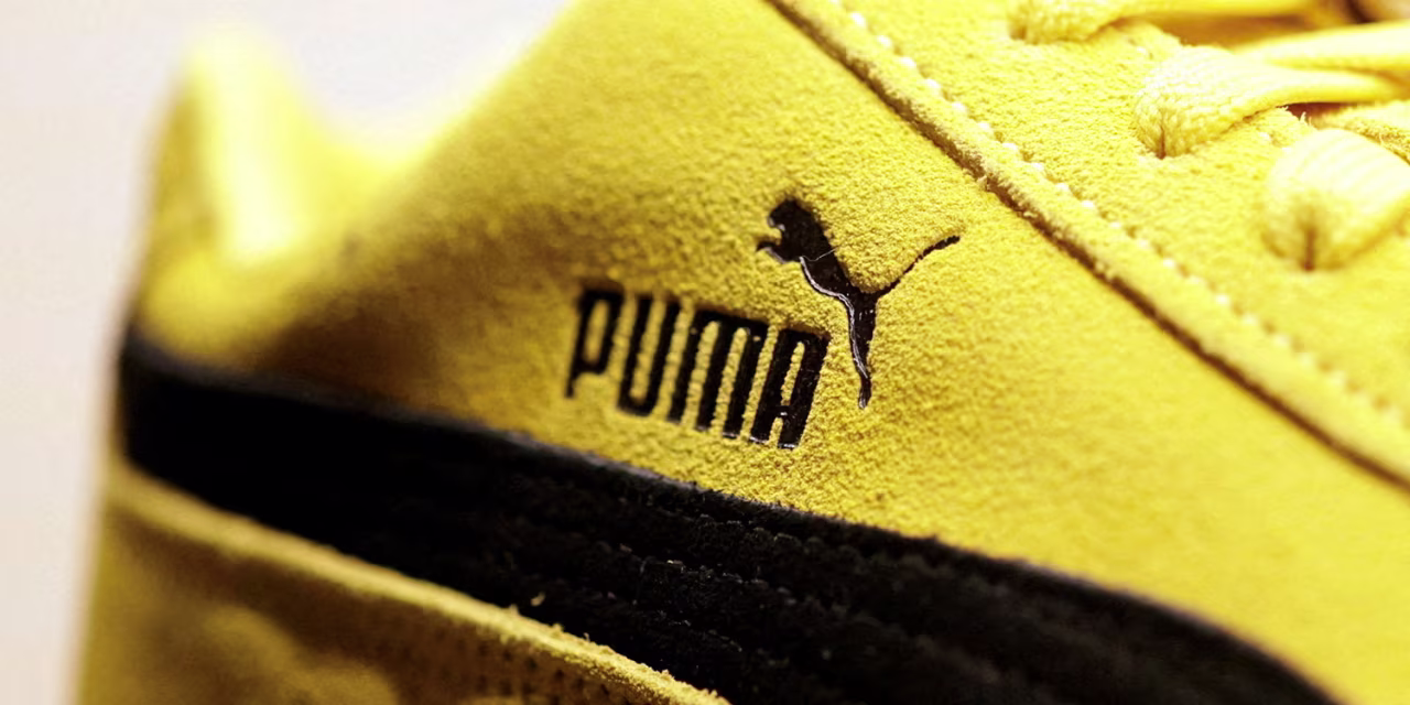 Puma Shares Rise as Results Top Estimates Despite Swing to Loss