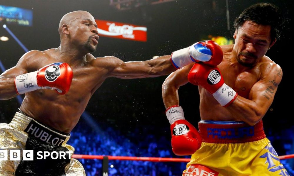 Floyd Mayweather throws a punch at Manny Pacquiao during their welterweight unification championship bout in May 2015 at MGM Grand Garden Arena in Las Vegas