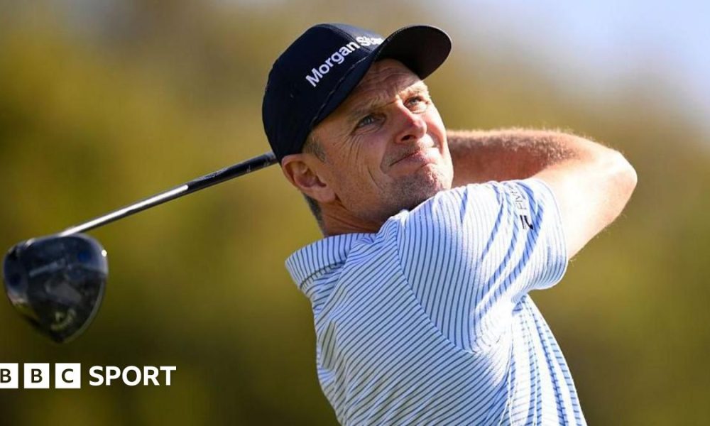 Justin Rose is presented the Championship trophy after winning the Farmers Insurance Open
