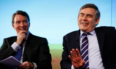 Ex-Prime Minister and Labour Party leader, Gordon Brown, right, and then-Business Secretary Peter Mandelson react as they speak to the media about economy in a press conference in London, Monday, April 19, 2010.
