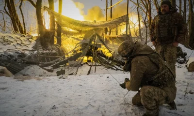 Ukrainian soldiers of the 48th separate artillery brigade fire at Russian positions on the frontline in Kharkiv region, Ukraine, Wednesday, Feb. 18, 2026.