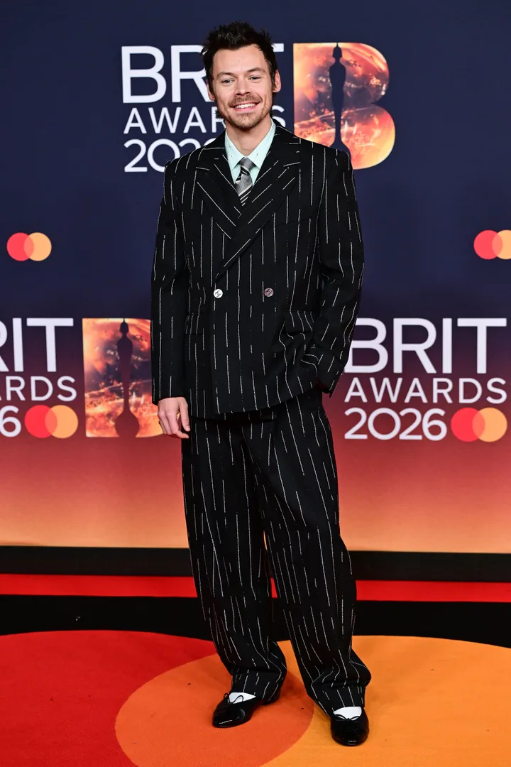 What a smile, what a suit, what a shoe choice