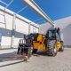 Industrial warehouse construction. Rotating telehandler vehicle
