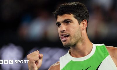 Carlos Alcaraz sticks out his tongue in celebration during the 2026 Australian Open final