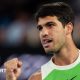 Carlos Alcaraz sticks out his tongue in celebration during the 2026 Australian Open final