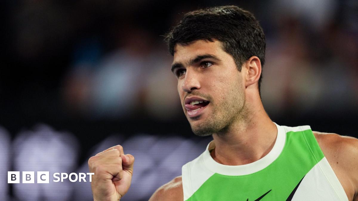 Carlos Alcaraz sticks out his tongue in celebration during the 2026 Australian Open final
