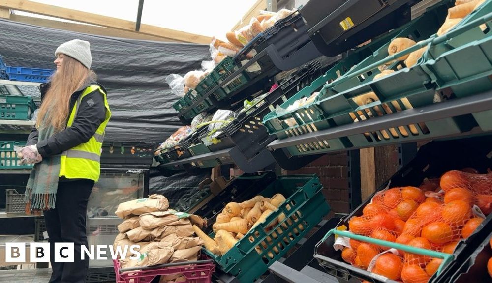 Closing factory workers paid to help at food bank