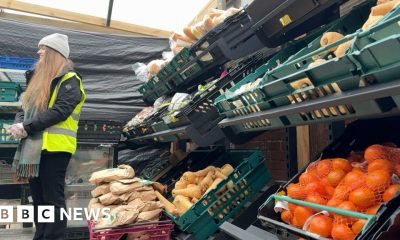 Closing factory workers paid to help at food bank
