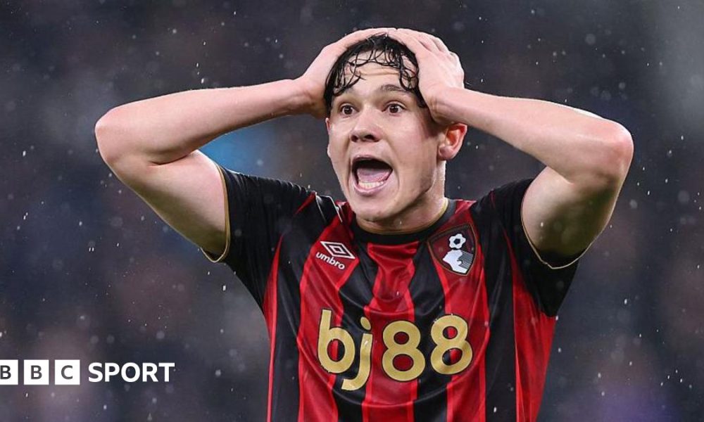 Close-up of Bournemouth's Alex Toth. The team's red-and-black striped shirt has a bj88 sponsorship logo in gold lettering across the front.