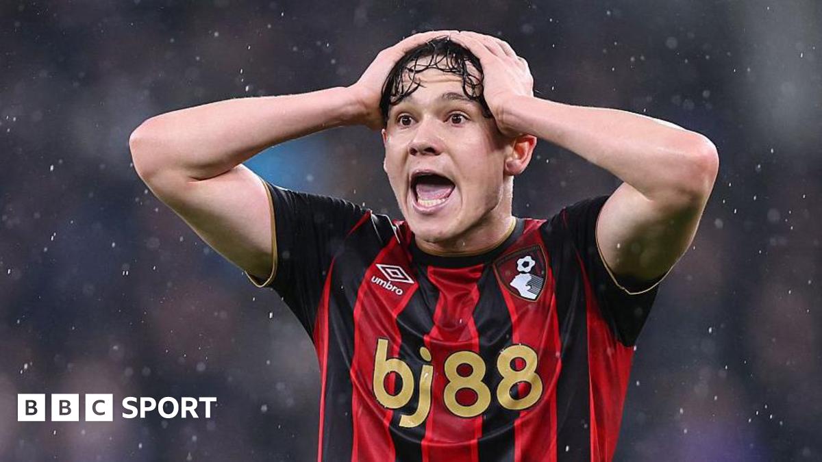 Close-up of Bournemouth's Alex Toth. The team's red-and-black striped shirt has a bj88 sponsorship logo in gold lettering across the front.