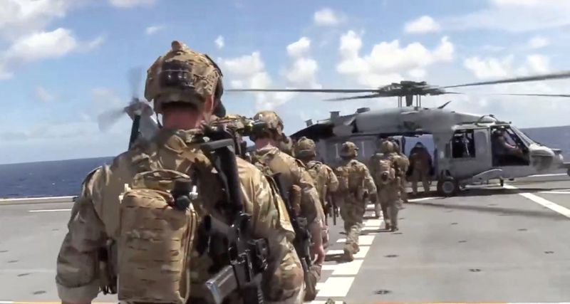 US says it interdicted and boarded vessel defying Trump’s quarantine