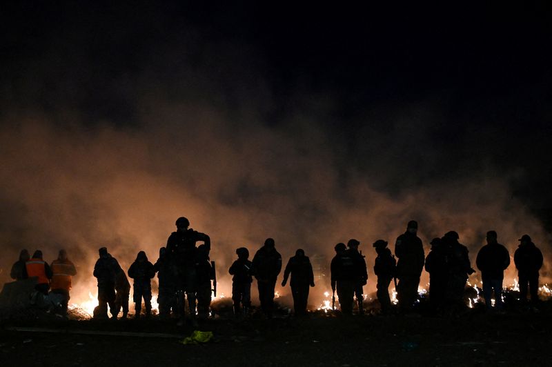 Residents protest as authorities burn cash left on ground by Bolivian plane crash