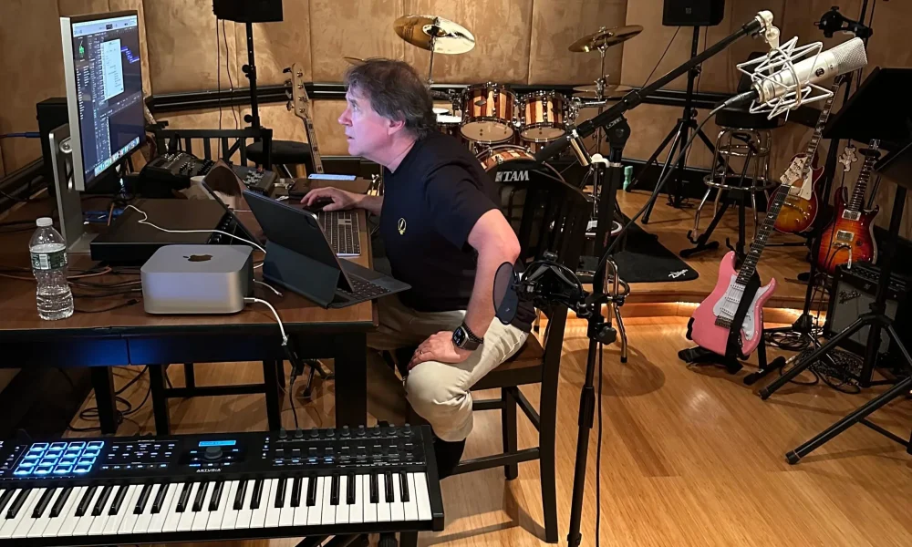 Paul Hennesy sitting in his music studio