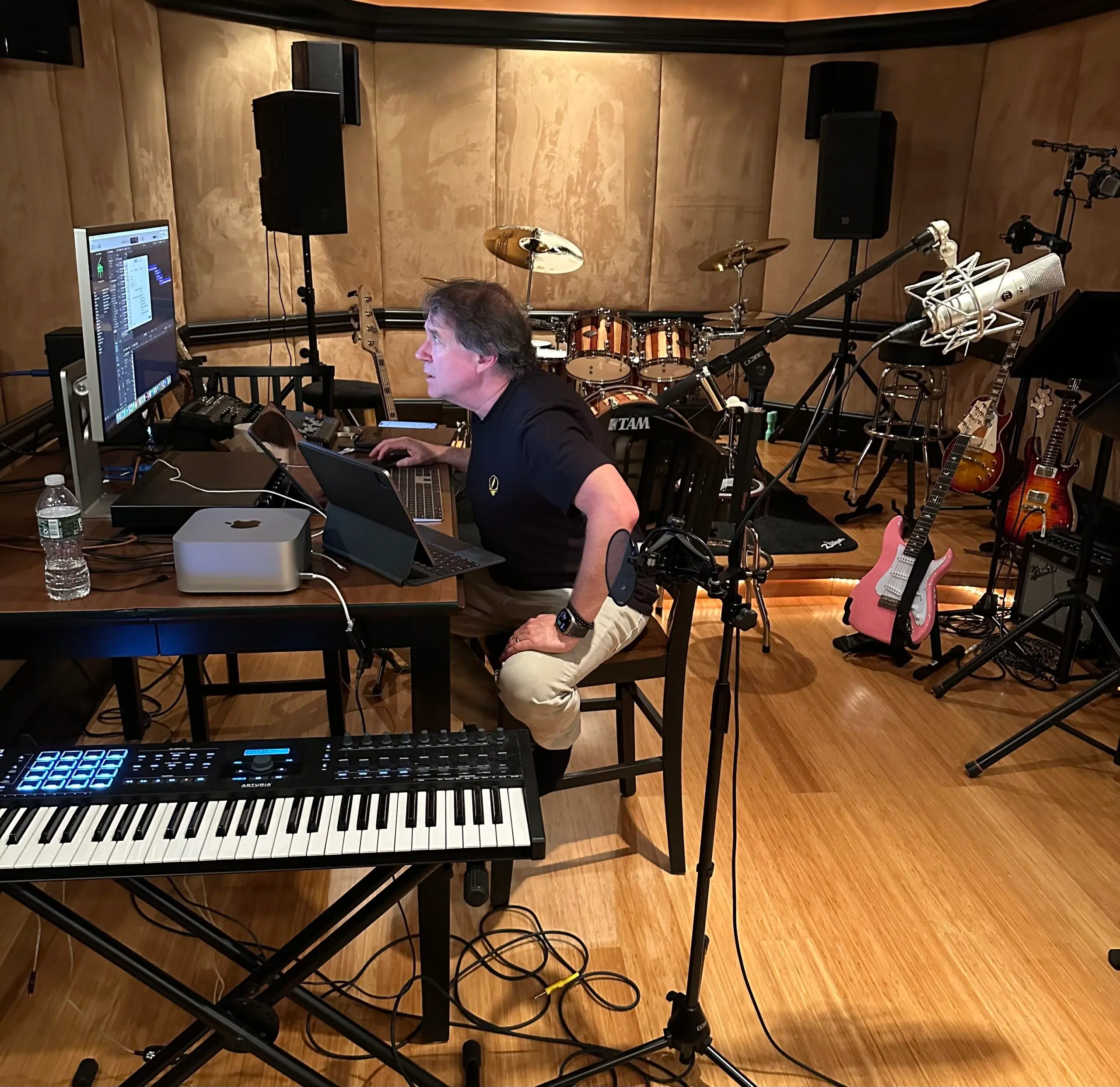 Paul Hennesy sitting in his music studio