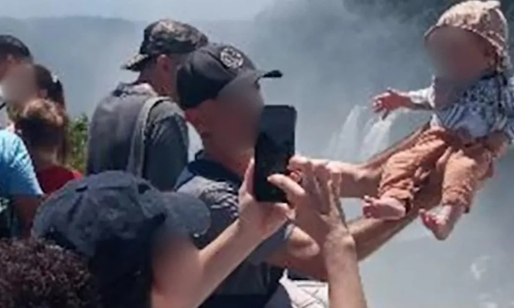 Tourist dangles baby over edge of 260ft waterfall for a holiday snap in Argentina | News World