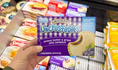 Smucker opening the fridge for Uncrustables