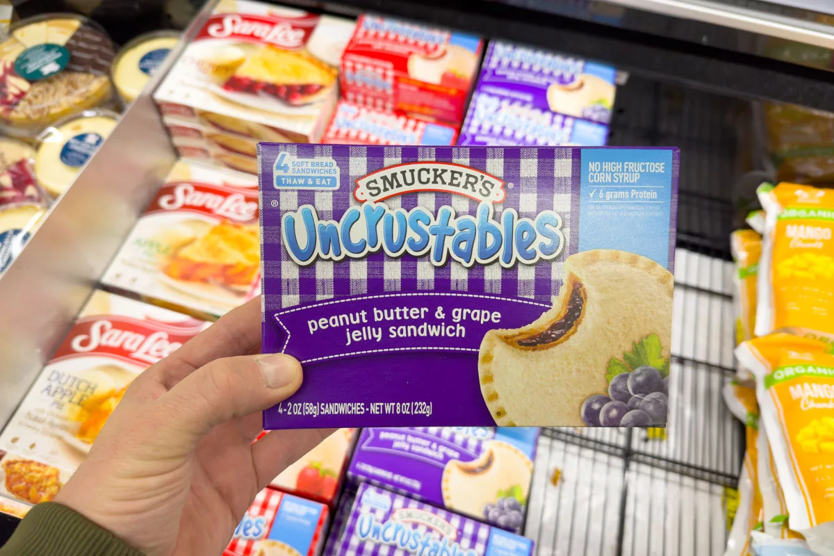 Smucker opening the fridge for Uncrustables