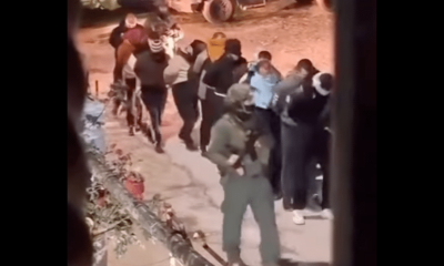 Israel marches detained Palestinians through street