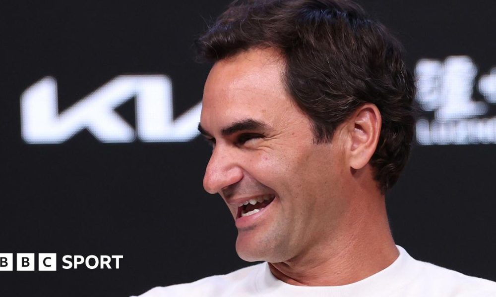 Roger Federer laughs during a news conference at the 2026 Australia Open