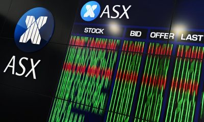 Aussie shares edge lower after record-breaking week