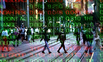 Australian shares reverse early dip as miners soar