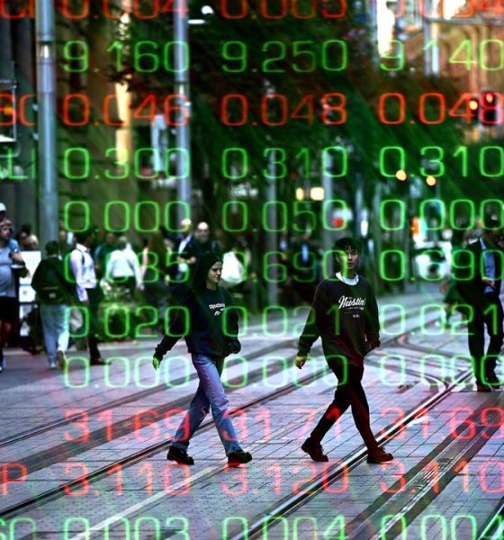 Australian shares reverse early dip as miners soar