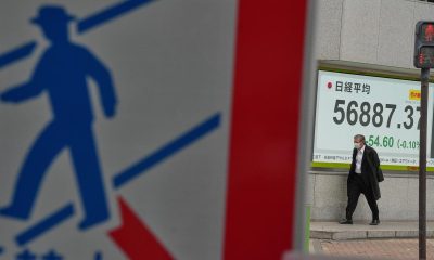 Shares edge up in thinly-traded Asian holiday markets