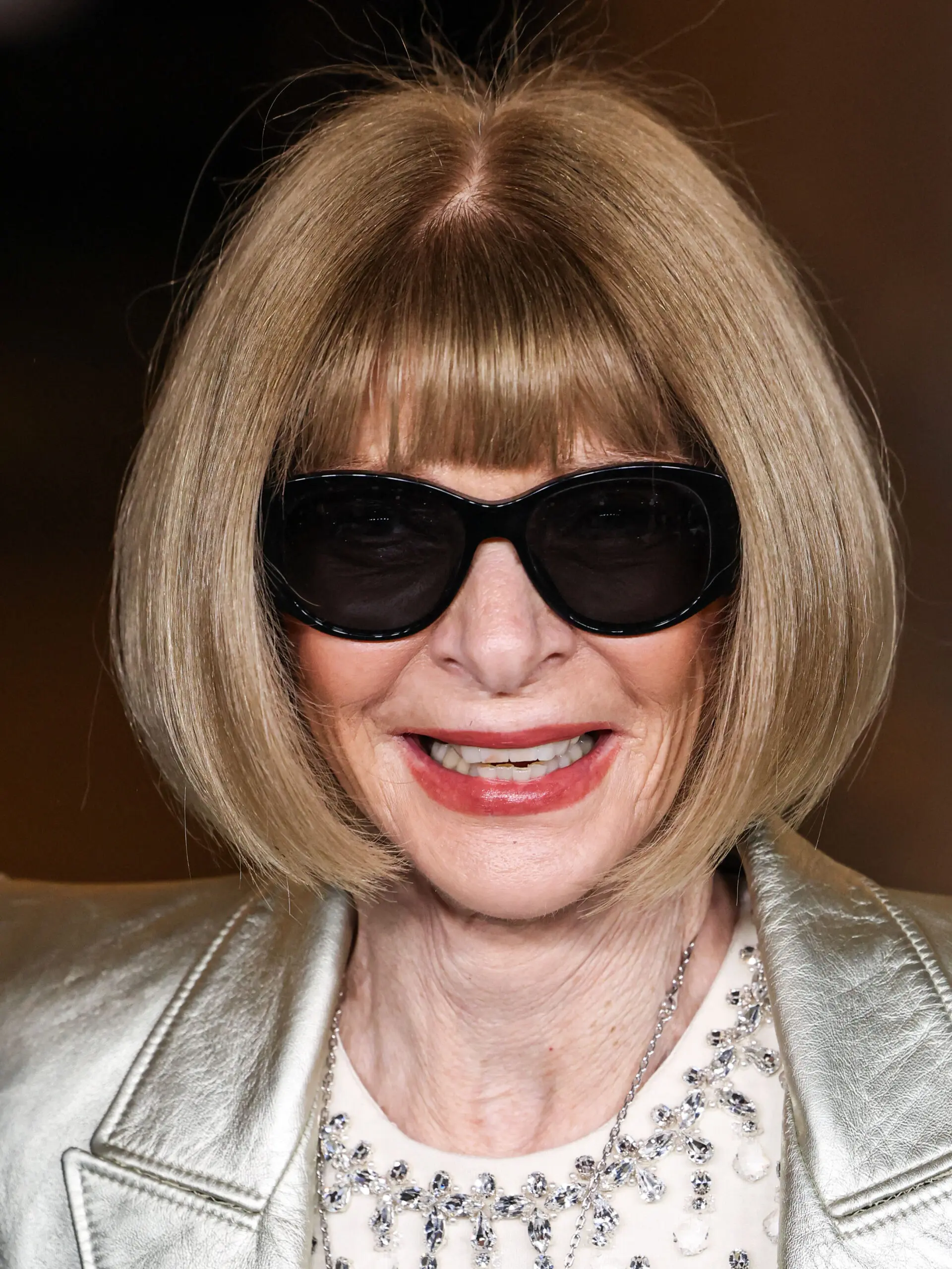 Anna Wintour posing on the red carpet.