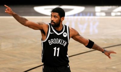 Anti-vaxxers stormed the Barclays Center Sunday with many holding up "stand with Kyrie" signs. In photo: Brooklyn Nets star Kyrie Irving.