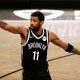 Anti-vaxxers stormed the Barclays Center Sunday with many holding up "stand with Kyrie" signs. In photo: Brooklyn Nets star Kyrie Irving.