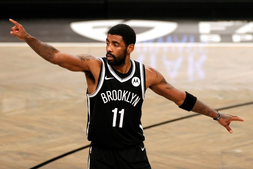 Anti-vaxxers stormed the Barclays Center Sunday with many holding up "stand with Kyrie" signs. In photo: Brooklyn Nets star Kyrie Irving.