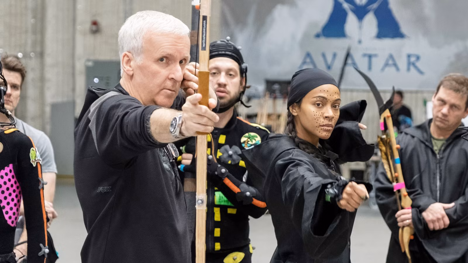 James Cameron on the set of Avatar with Zoe Saldaña next to him