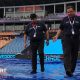 ICC officials walk on rain-soaked covers at  Pallekele Cricket Stadium in Kandy