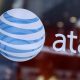 Citing regulatory uncertainty around the classification of broadband Internet, AT&T said Wednesday it will pause capital investments in 100 cities.