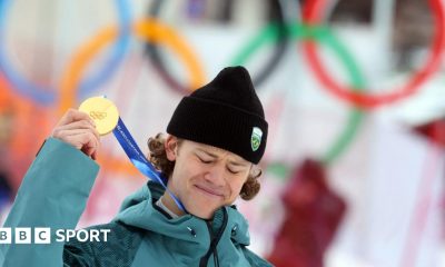 Lucas Pinheiro Braathen holds up his Olympic gold medal