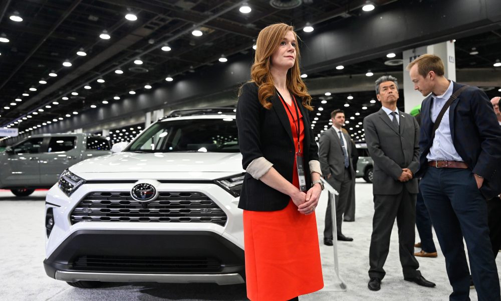 Mallory McMorrow listens to a speaker talk about Toyota vehicles at the Detroit Auto Show on Jan. 14.