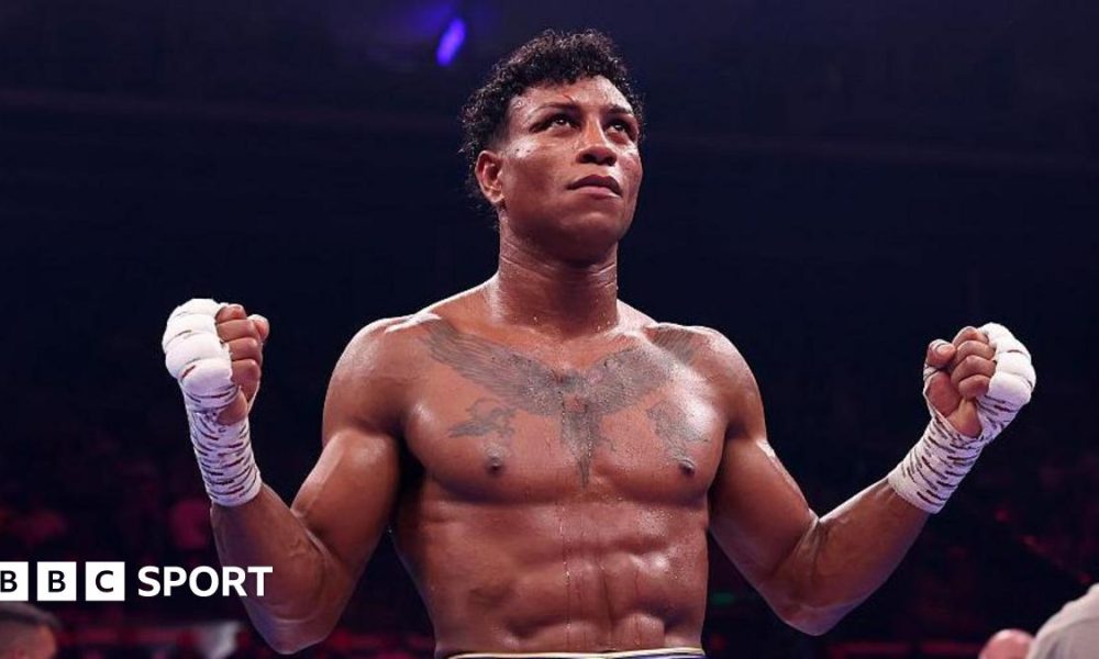 Bilal Fawaz extends his hands in celebration after his win over Junaid Bostan