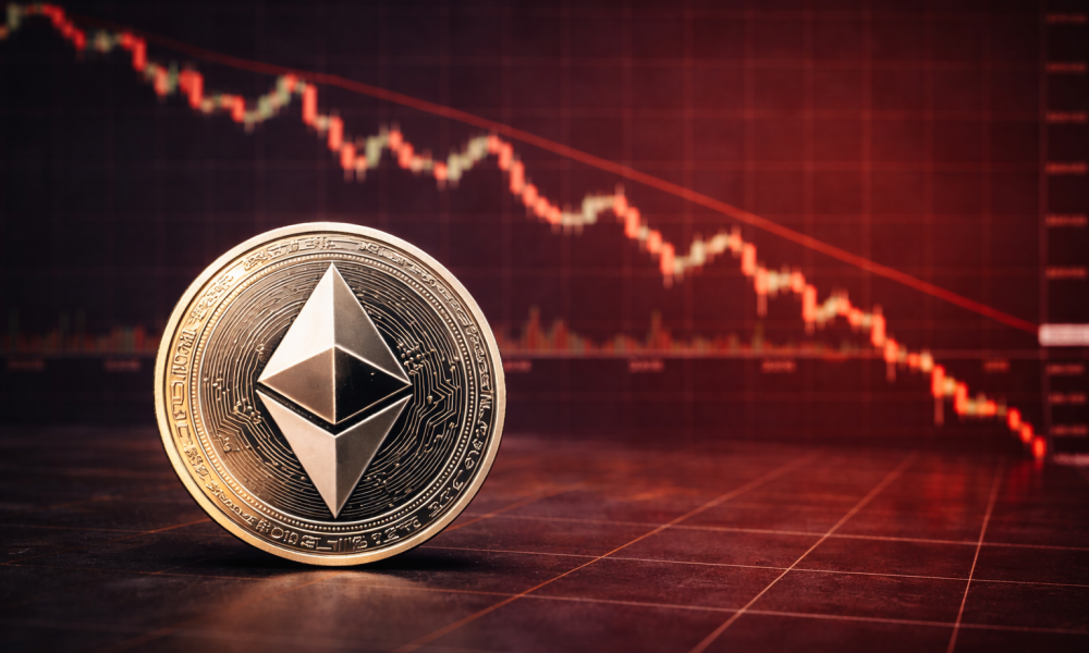 An Ethereum coin placed in front of a red downward cryptocurrency price chart showing a market decline.
