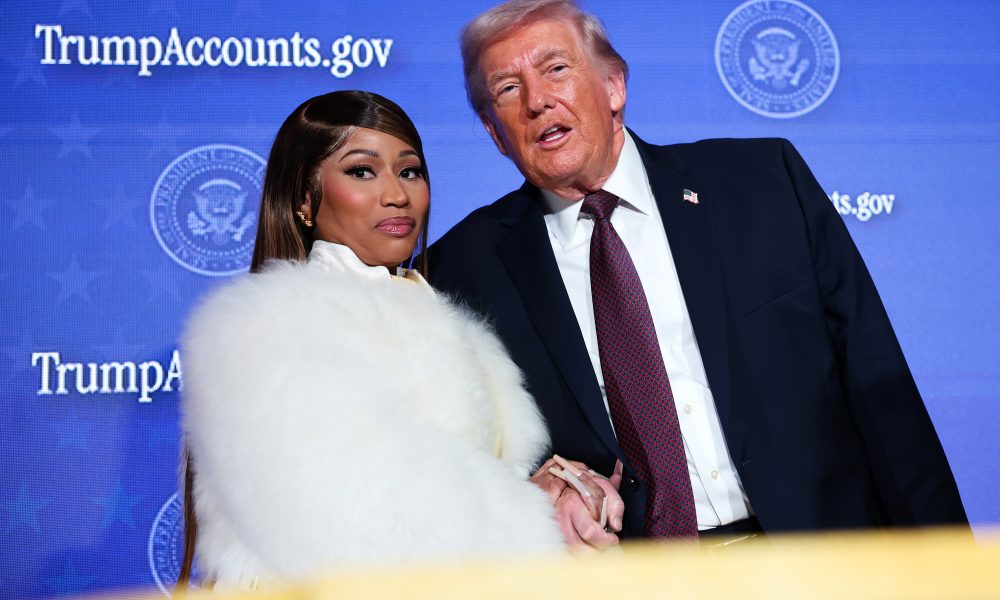 Musician Nicki Minaj joins President Donald Trump on stage as he delivers remarks during the Treasury Department's Trump Accounts Summit on Jan. 28, 2026 in Washington, D.C.