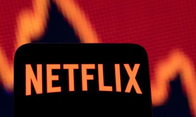 Illustration shows Netflix logo and stock graph